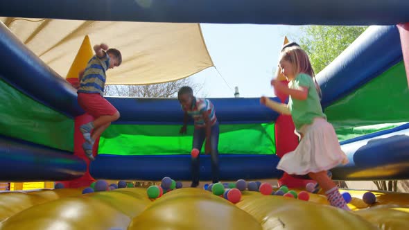 Kids playing on the bouncing castle