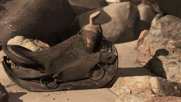 Very Old Horse Saddle on Sand Beach