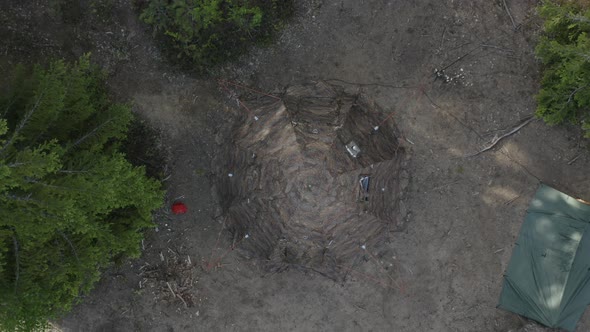 Drone top view on camping tent with camouflage.