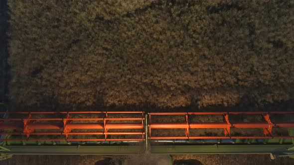 Combine Harvester at Night During the Harvest