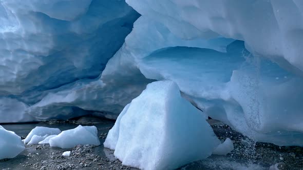 Glacier Melting. Crane Shot Inside Ice Cave