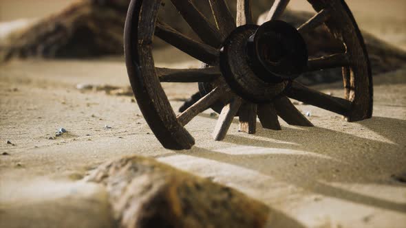 Large Wooden Wheel in the Sand