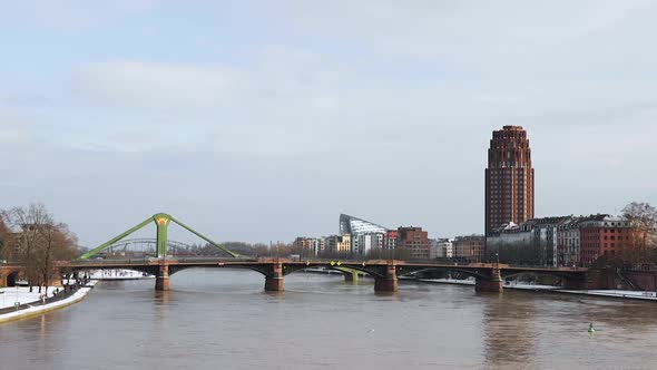 Lindner Hotel And Residence Main Plaza, Ignatz Bubis And Raftsman Bridge Over Main River In Winter A