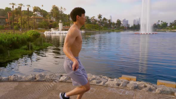 Young Asian man working out in a park in Los Angeles.