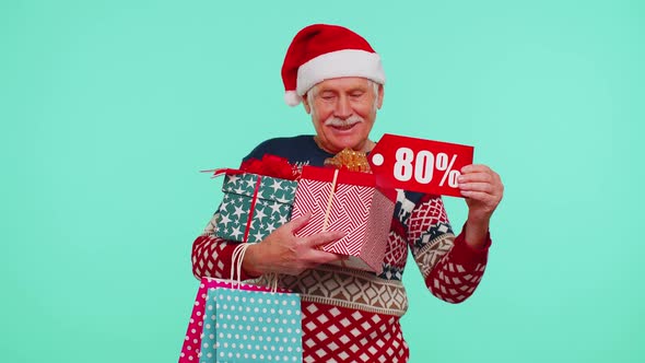 Grandfather in Christmas Sweater Showing Gift Box and 80 Percent Discount Inscriptions Banner Text