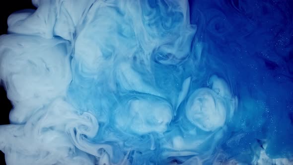 Colored Abstract Smoke Blue White Ink and Paint Liquid Reaction Background Texture