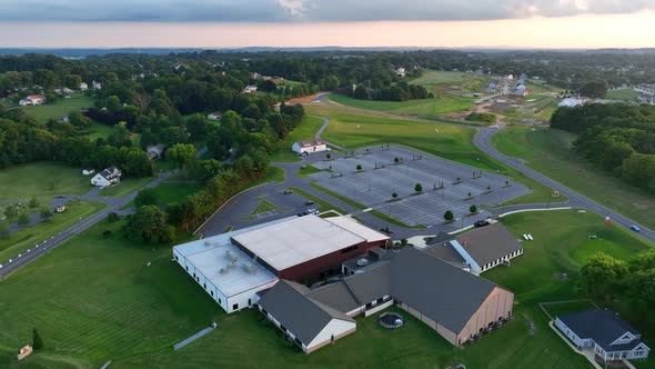 Rural Christian American church. Large evangelical building and parking lot. Beauty evening and suns