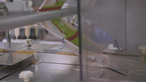 Close up of an automated process for packaging cake bars. Laser technology guides precision