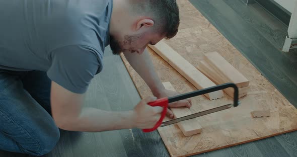 Man is Building Furniture Himself Making Renovation at Home