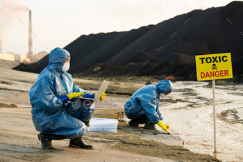 of polluted water and soil on background of colleague taking samples in toxic area
