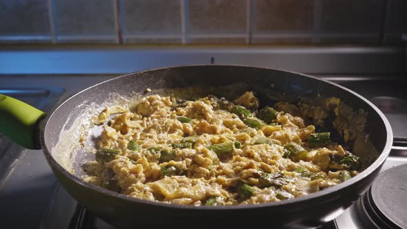 Cooking Low Carb Meal For Dinner, Asparagus With Eggs, In A Pan. close up