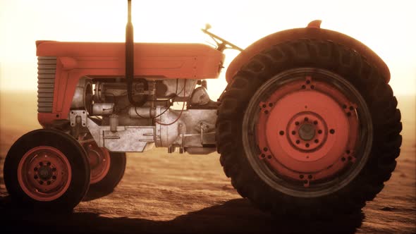 Vintage Retro Tractor on a Farm in Desert