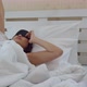 Asian young woman waking and touching alarm clock - VideoHive Item for Sale