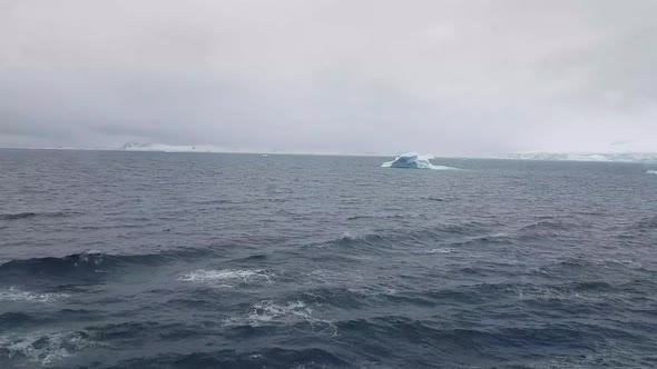 Antarctic Landscape with Icebergs in Foreground