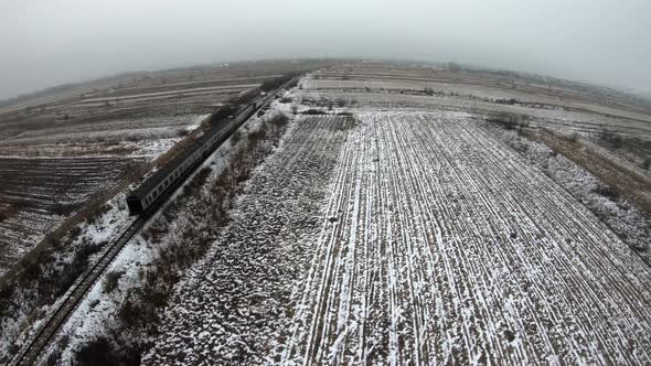 Following the train with the drone. Close-up of aing train