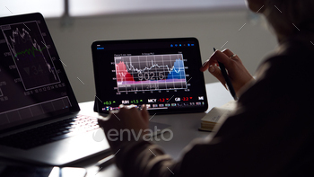  Price Data Displayed On Laptop And Digital Tablet