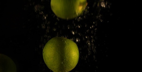Fresh Limes Falling In Water Slow Motion