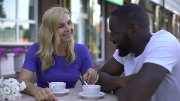 Romantic Date of Multiracial Pair, Blond Woman Flirting With Bearded Male, Love