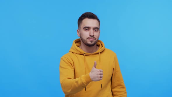 Expressive young man screaming and shouting over vibrant background.