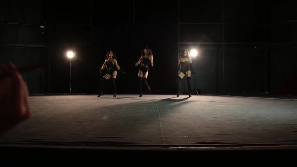 Burlesque Girls Dance in Front of Two Gentlemen