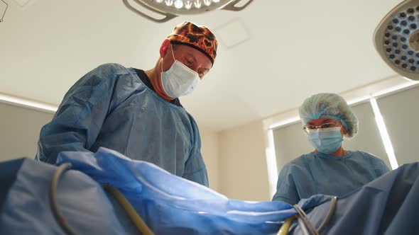 Team of Surgeons Operating in the Hospital