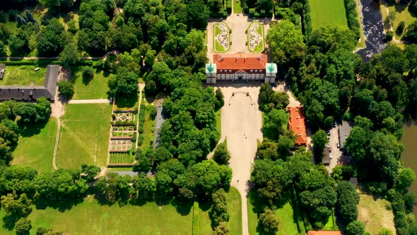 Beautiful avenue of trees of Nieborow Palace, a Baroque style residence in Poland. Colourful foliage