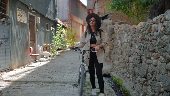 Woman Walking With Bikes