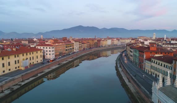 Pisa, Italy - Flyover Arno River at Dusk