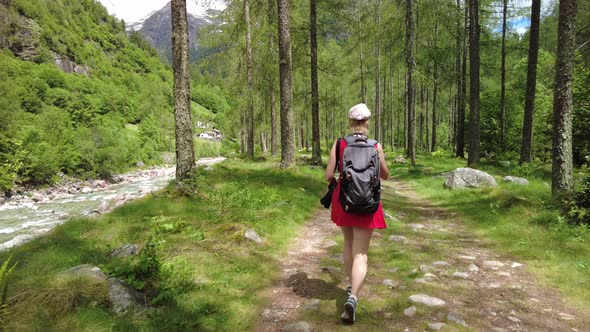 Woman Trekking to Froda Waterfall of Sonogno