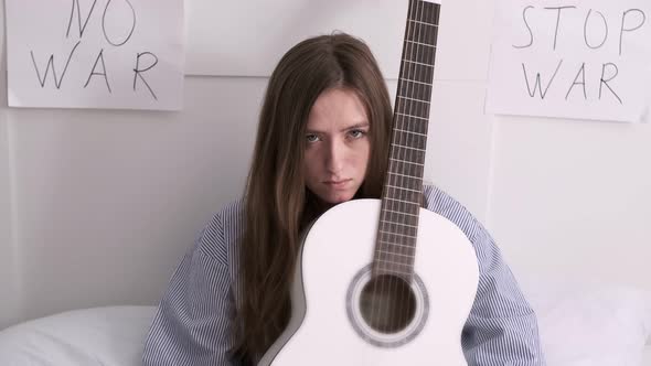 Woman Plays Guitar