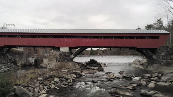 Aerial Pullback Revealing The Taftsville Bridge Over The Ottauquechee River.