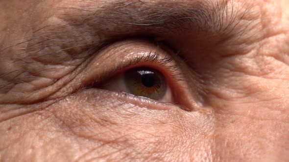 One Eye of the Elderly Man Looks to the Side