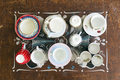 Top view of various tea cups and saucers on wooden table - PhotoDune Item for Sale