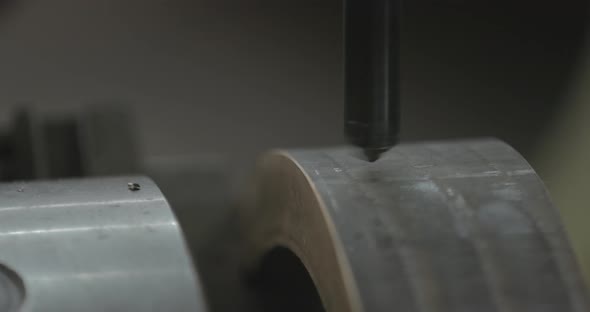 Steel part being drilled