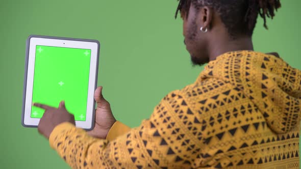 Young Handsome African Man Using Digital Tablet