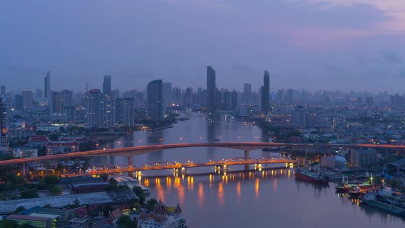 Time lapse of aerial view of Bangkok City skyline by Chao Phraya River in Thailand.