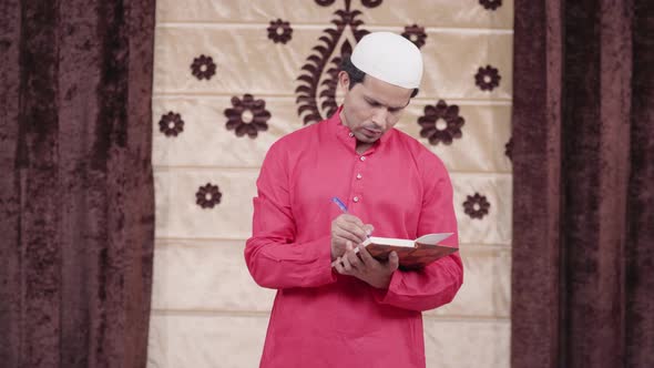 Muslim man writing poem