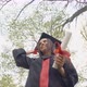 Cheerful Young Lady Putting Off Mortarboard Throwing Up Jumping Outdoors in Park - VideoHive Item for Sale