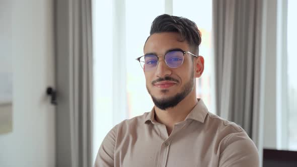 Portrait of Smart Indian Business Man Looking at Camera at Home Office