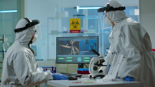 Biotechnology Scientist Wearing Ppe Suit Researching in Equipped Laboratory