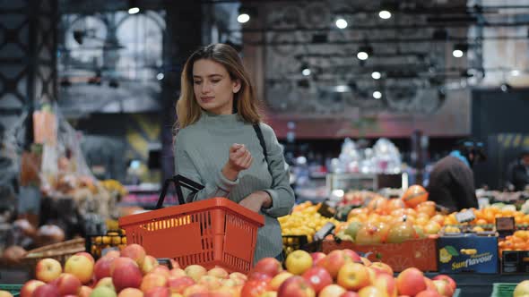 Caucasian Female Consumer Woman Shopper Buyer with Basket Walks to Grocery Store Supermarket Looking