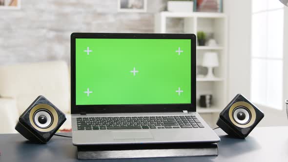 Chroma Isolated Laptop with Green Screen on the Table