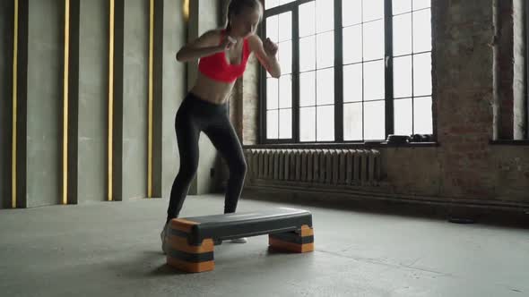 Woman Jumping on Step Platform Slow Motion