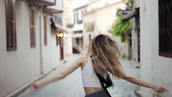 Blonde Woman Dance Outdoors Spinning Around Emotional