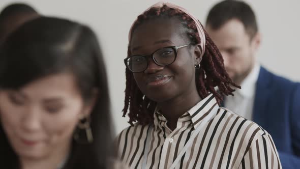 African Woman Smiling on Conference