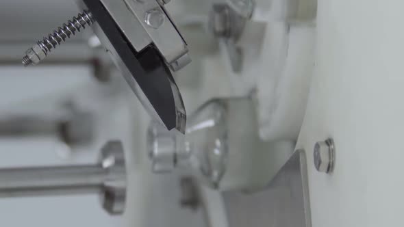 Vertical Video Glass Bottles Filled and Sealed with Rubber Caps on a Medical Solution Conveyor Line