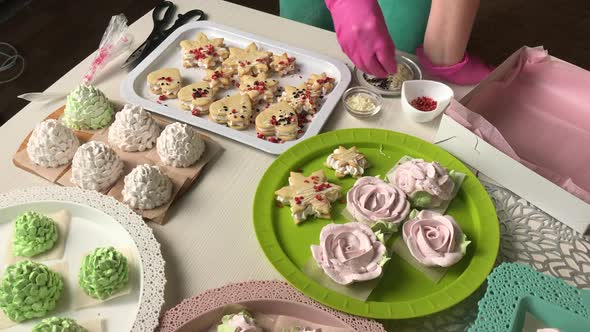 Woman Prepares Marshmallow Sandwiches.