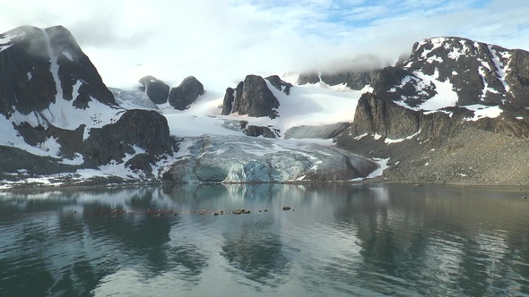 Beautiful Arctic landscape with mountains covered with glaciers in the Svalbard archipelago