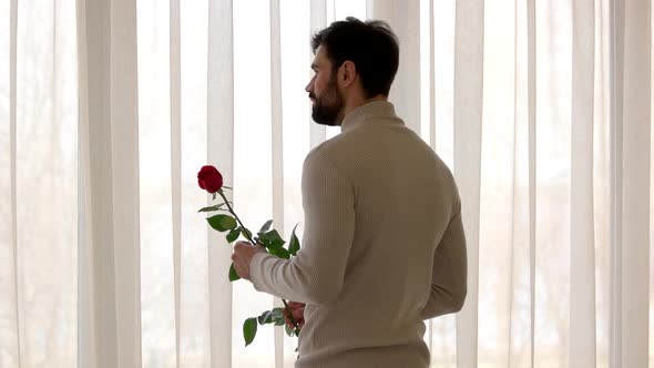 Bearded Man Holding Rose