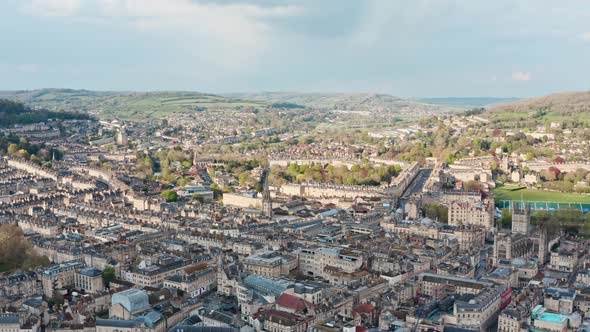 Dolly back drone shot over old buildings in Bath UK